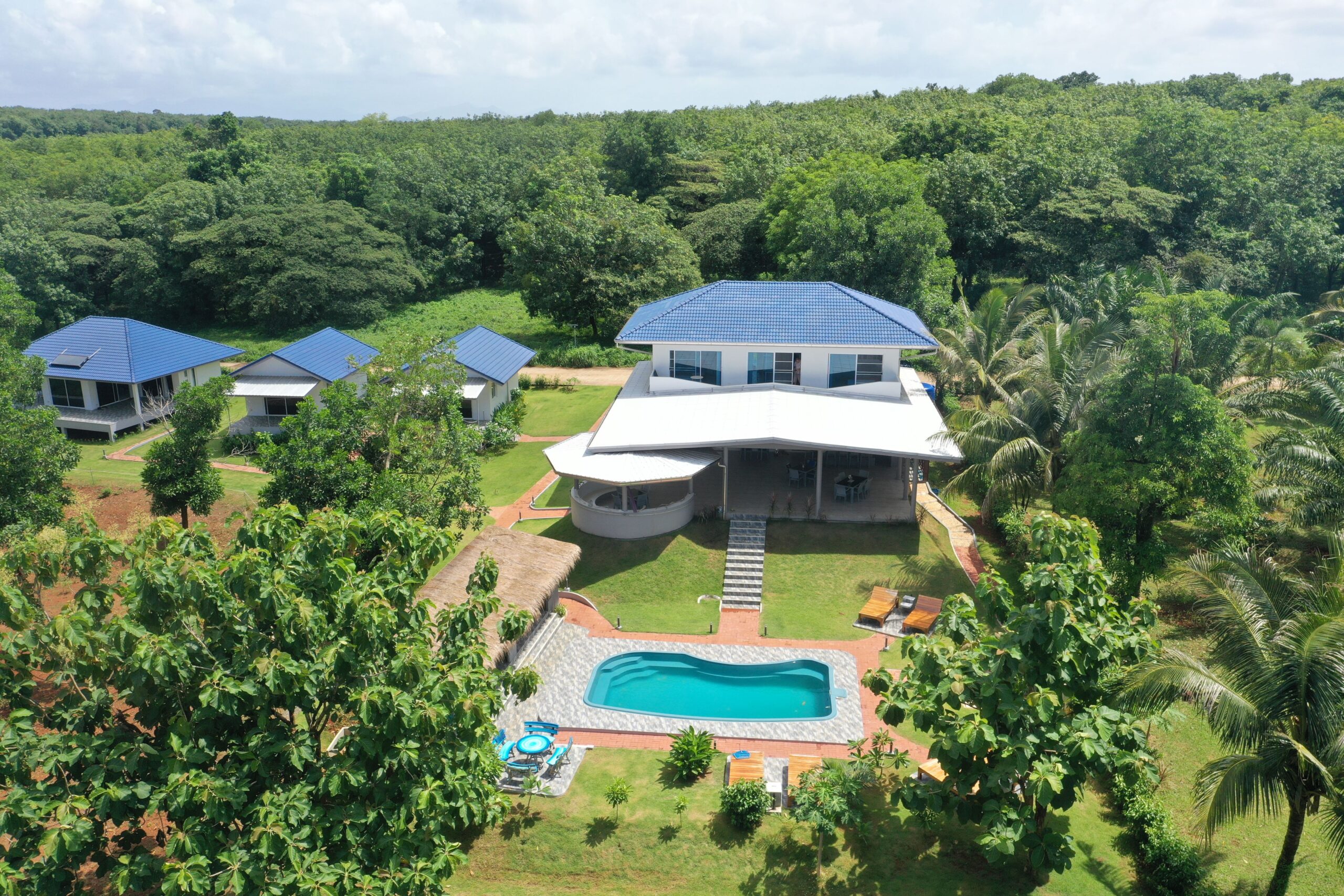 Aerial view of Corsita Resort with swimming pool and tropical gardens on Koh Mak