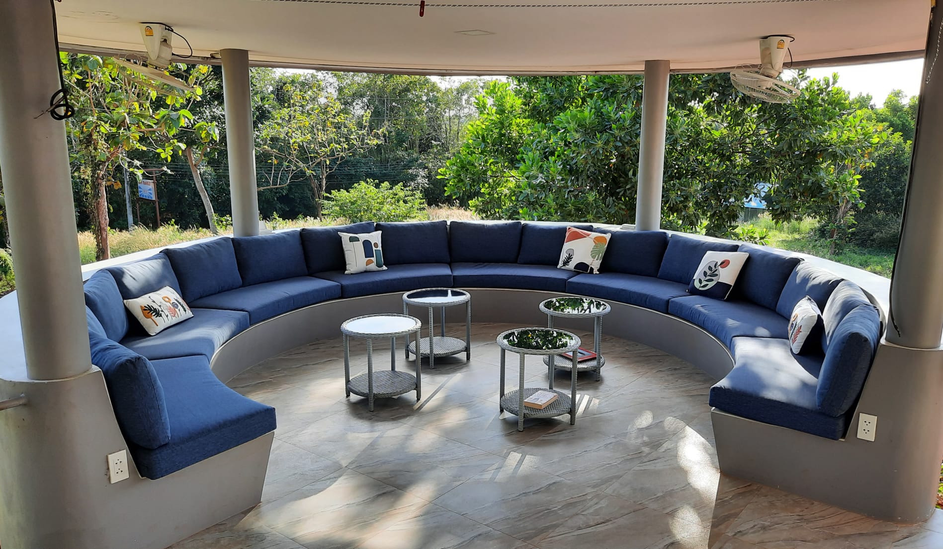 Circular lounge area with blue seating at Corsita Resort on Koh Mak